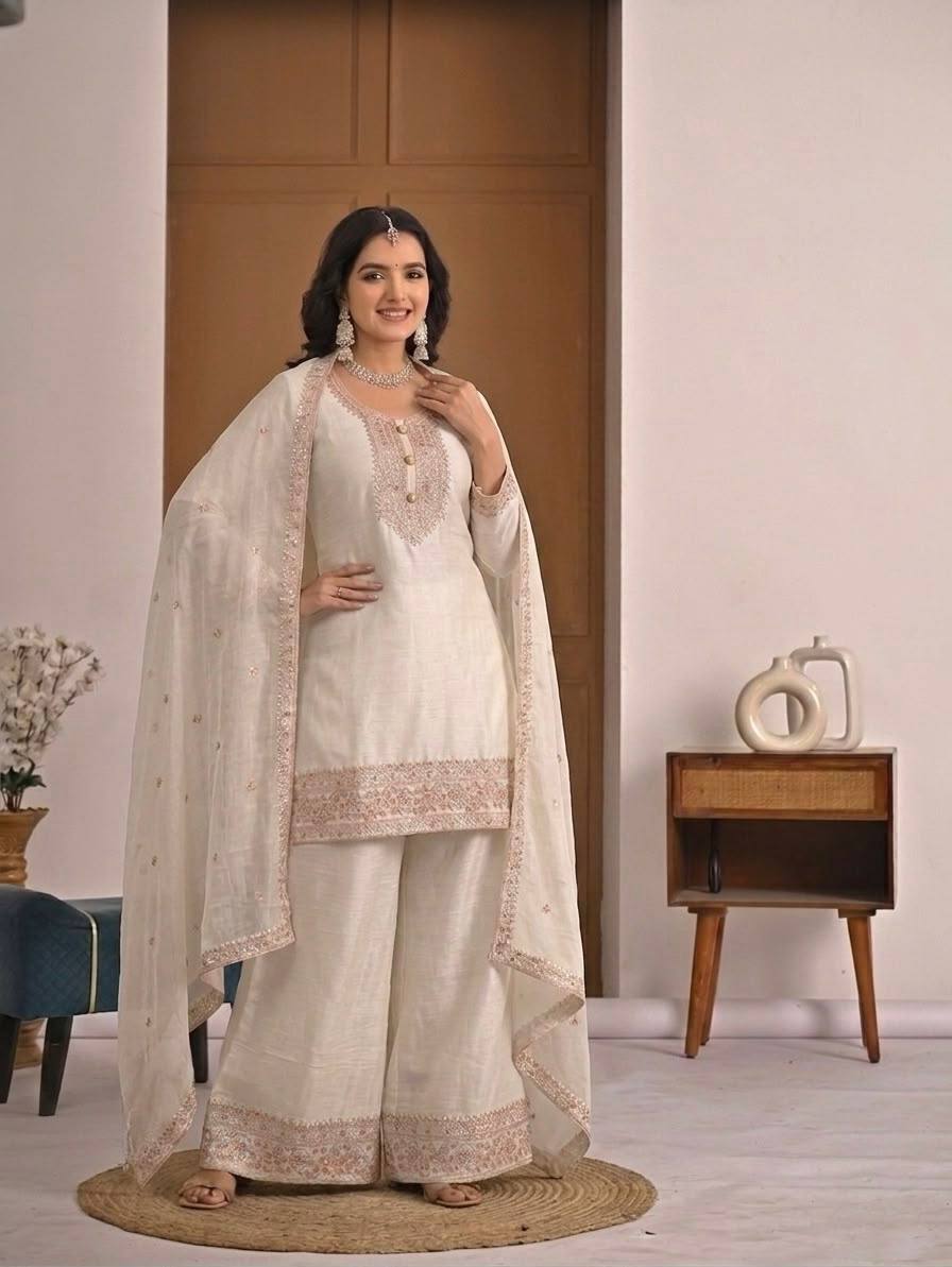 Pristine Ivory White Kurta and Palazzo Set Featuring Delicate Floral Embroidery, Sequined Borders, and a Matching Sheer Dupatta